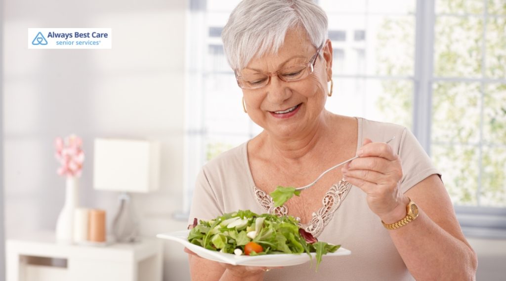 Encouraging Healthy Eating: How to Boost Your Senior’s Appetite in Oakville, ON 6 Posts Happy senior woman enjoys a fresh green salad, reinforcing messages of healthy lifestyle and senior self-care.