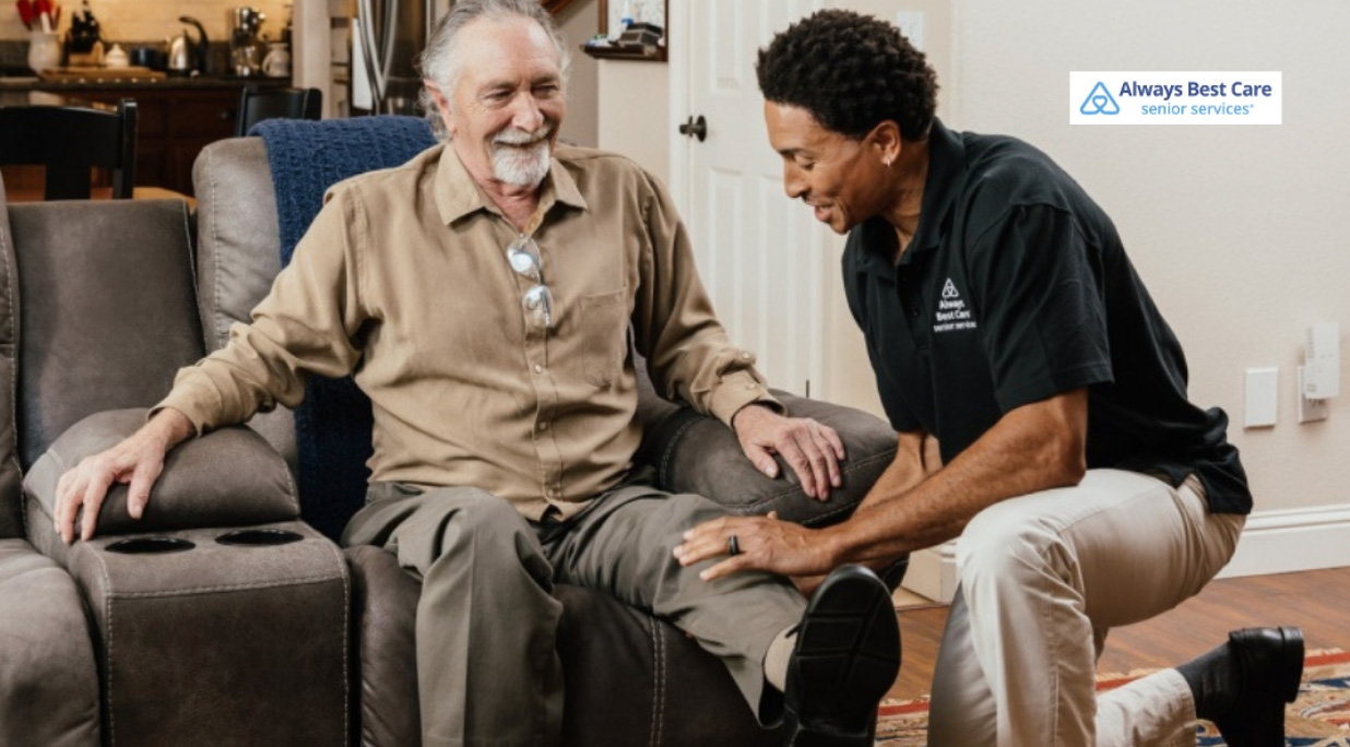 caregiver assisting senior man